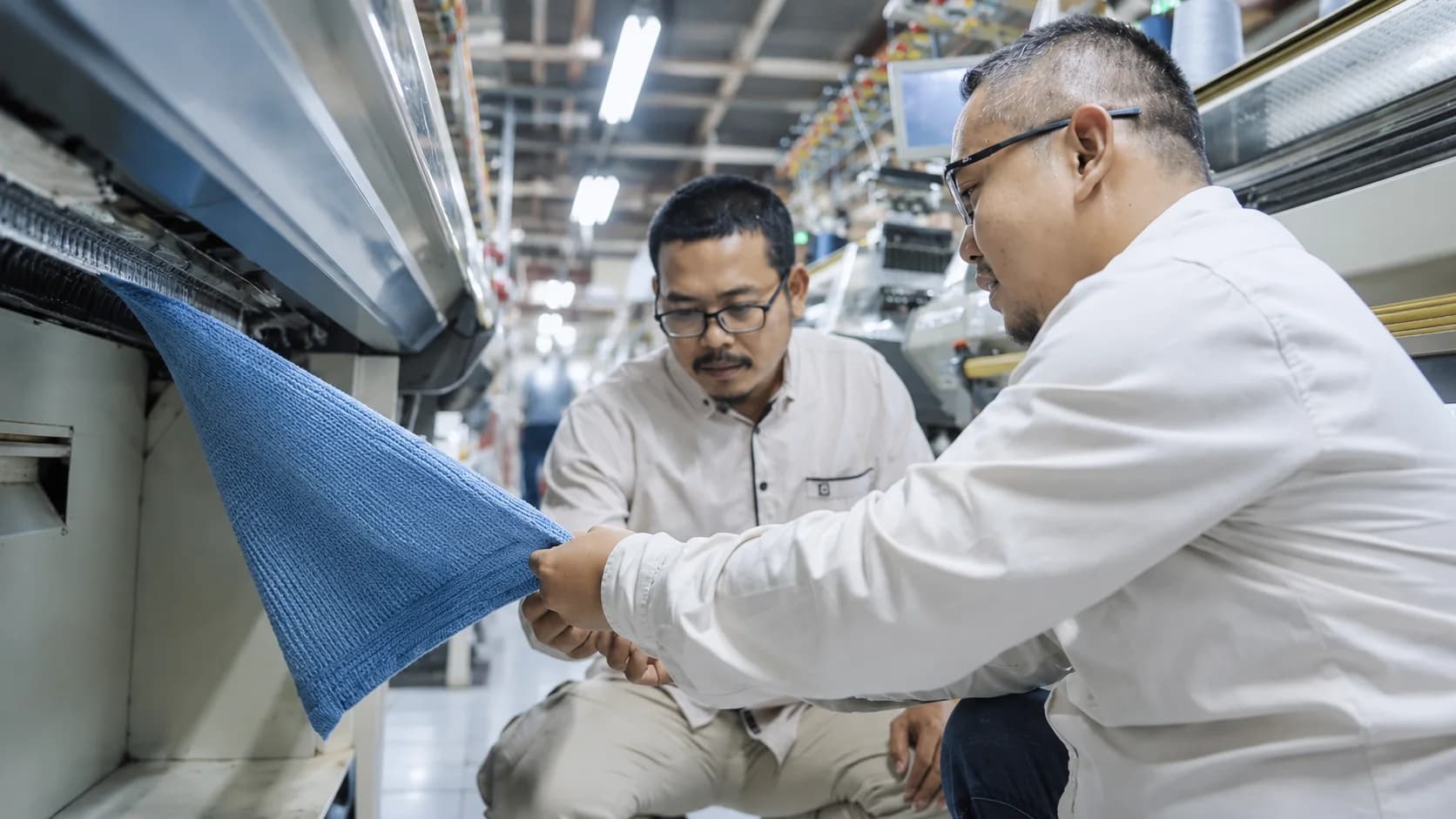 Operators working at the mass sewing assembly line