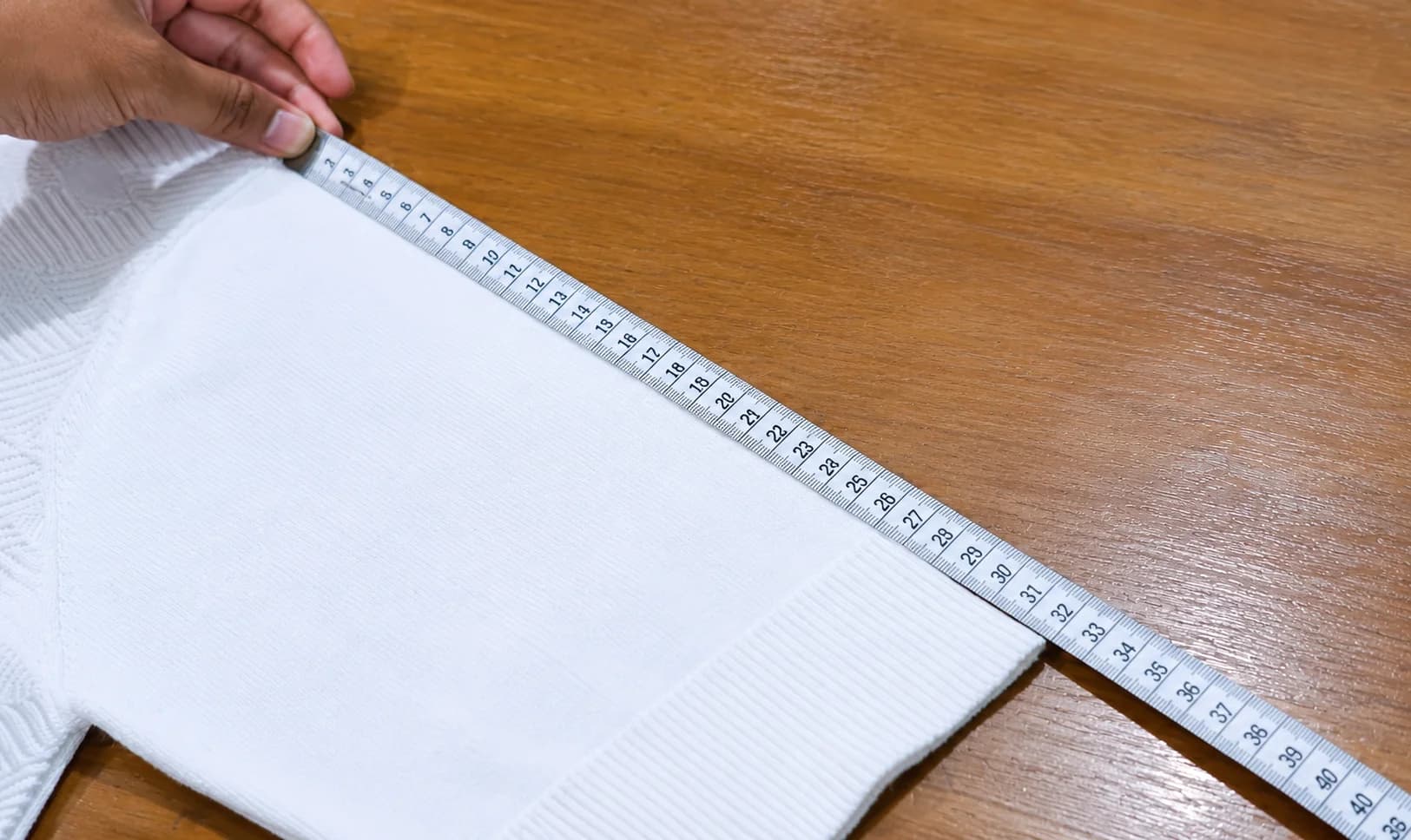 Knitting machines producing garment panels